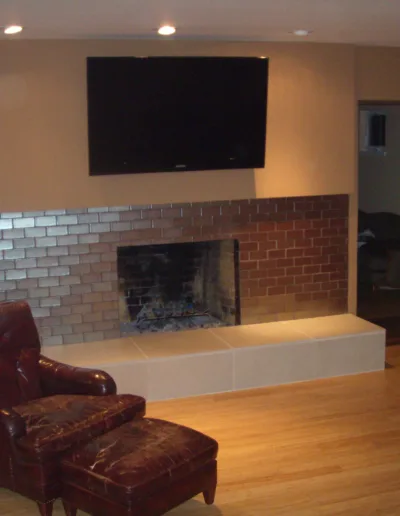 A living room with a fireplace and a tv.