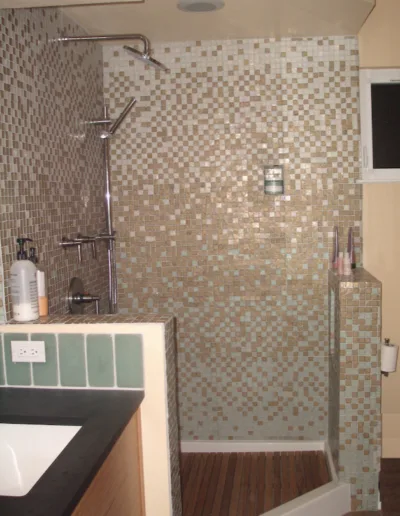 A tiled shower in a bathroom.